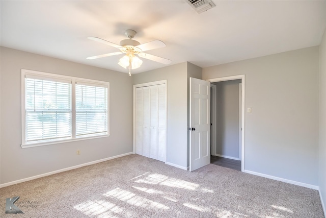821 Cherry Ln, Clyde, TX 79510 - unfurnished bedroom featuring a closet, carpet flooring, baseboards, and ceiling fan