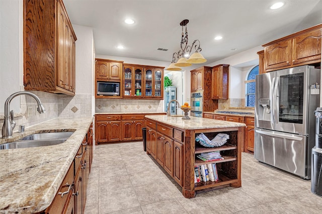 1217 Kent Brown Rd, Garland, TX 75044 - kitchen featuring stainless steel appliances, a sink, light stone countertops, decorative backsplash, and recessed lighting