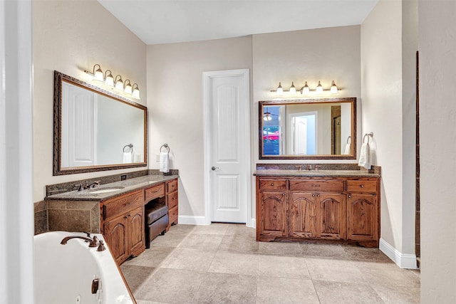 1217 Kent Brown Rd, Garland, TX 75044 - full bathroom with baseboards, a whirlpool tub, and two vanities