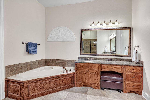 1217 Kent Brown Rd, Garland, TX 75044 - bathroom featuring a garden tub, tiled shower, and vanity