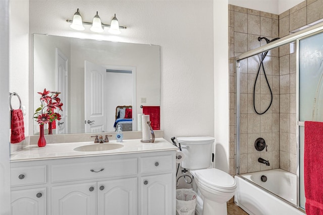1217 Kent Brown Rd, Garland, TX 75044 - full bathroom with toilet, vanity, shower / bath combination with glass door, and ensuite bath
