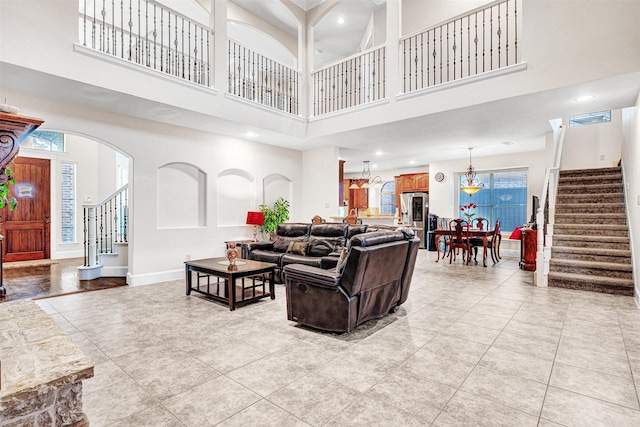 1217 Kent Brown Rd, Garland, TX 75044 - living area featuring stairs, a high ceiling, light tile patterned flooring, baseboards, and recessed lighting