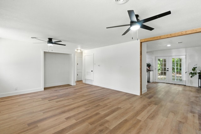 1423 W Ball St, Weatherford, TX 76086 - unfurnished living room featuring ceiling fan, light wood-type flooring, and french doors