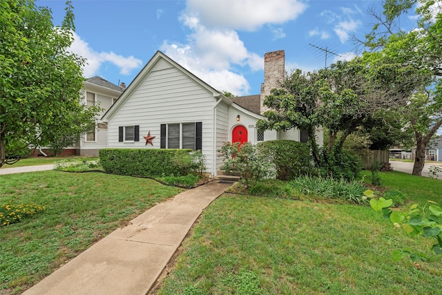 2530 Colcord, Waco, TX 76707 - view of front of house with a front lawn and a chimney