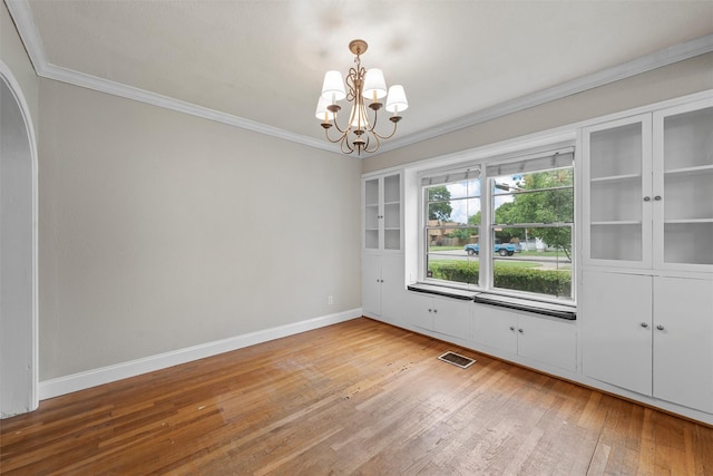 2530 Colcord, Waco, TX 76707 - empty room with hardwood / wood-style flooring, a chandelier, ornamental molding, and baseboards