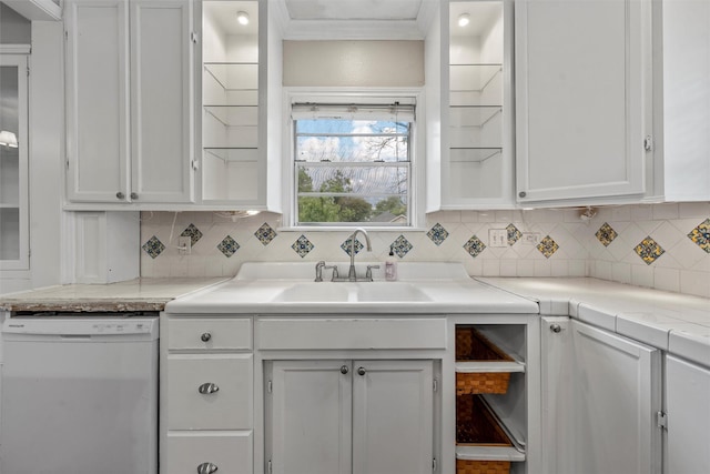2530 Colcord, Waco, TX 76707 - kitchen with white dishwasher, white cabinets, tasteful backsplash, and crown molding