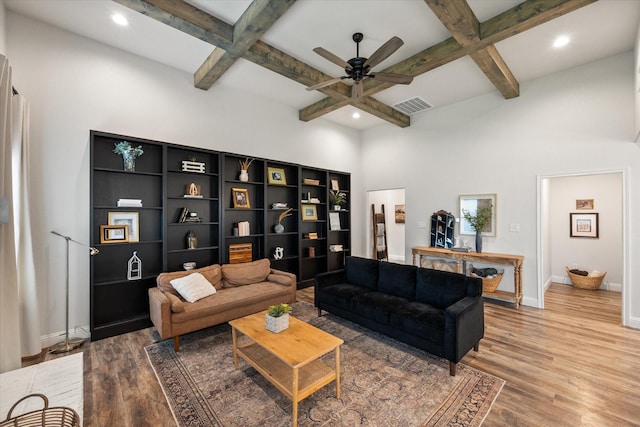 1321 Thistle Hill Trl, Weatherford, TX 76087 - living area with coffered ceiling, baseboards, ceiling fan, wood finished floors, and beamed ceiling