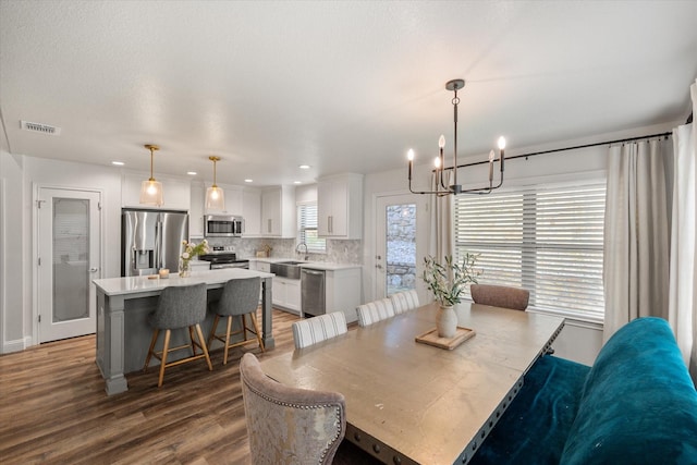 1321 Thistle Hill Trl, Weatherford, TX 76087 - dining space with a chandelier, dark wood-style flooring, and recessed lighting