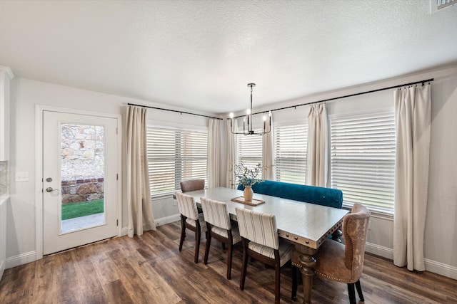 1321 Thistle Hill Trl, Weatherford, TX 76087 - dining area with a chandelier, baseboards, wood finished floors, and healthy amount of natural light