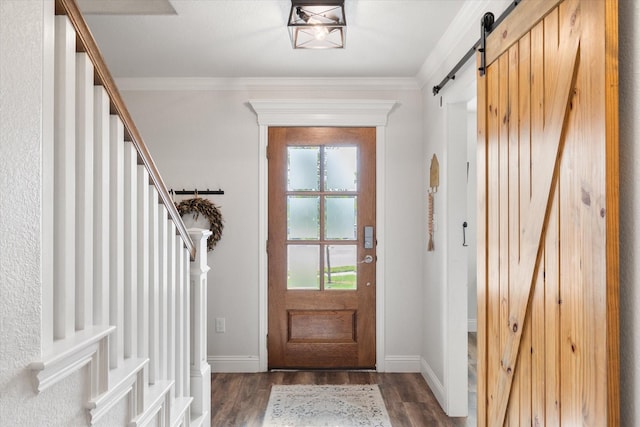 1321 Thistle Hill Trl, Weatherford, TX 76087 - entrance foyer featuring a barn door, stairway, wood finished floors, baseboards, and crown molding