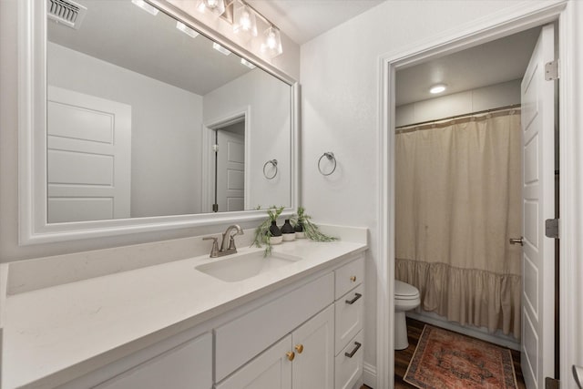 1321 Thistle Hill Trl, Weatherford, TX 76087 - bathroom featuring toilet, vanity, and curtained shower