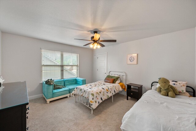 1321 Thistle Hill Trl, Weatherford, TX 76087 - carpeted bedroom with ceiling fan and baseboards