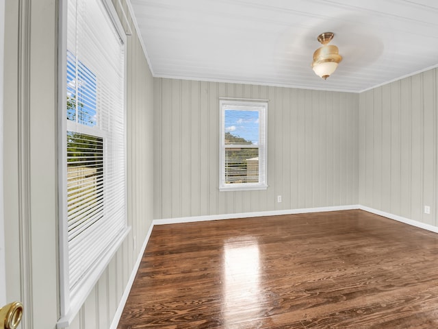 323 W Rentz St, Weatherford, TX 76086 - unfurnished room with wood finished floors, crown molding, and baseboards