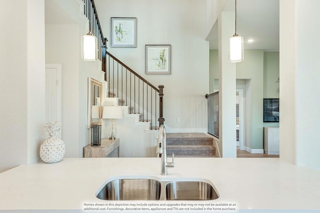 401 Sparrow Dr, Wylie, TX 75098 - kitchen featuring a sink, decorative light fixtures, and light countertops