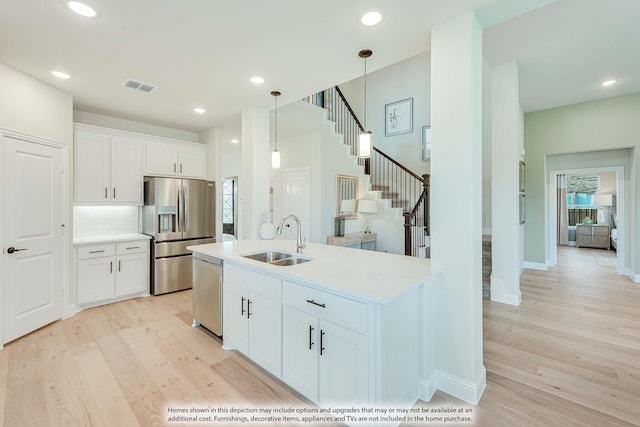 401 Sparrow Dr, Wylie, TX 75098 - kitchen featuring a sink, stainless steel appliances, light wood finished floors, light countertops, and recessed lighting