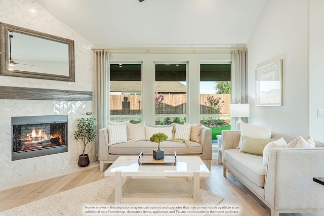 401 Sparrow Dr, Wylie, TX 75098 - living room featuring light wood-style flooring, plenty of natural light, vaulted ceiling, a fireplace, and ceiling fan