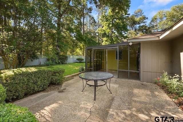 641 Hideaway Ln E, Hideaway, TX 75771 - view of patio with a sunroom