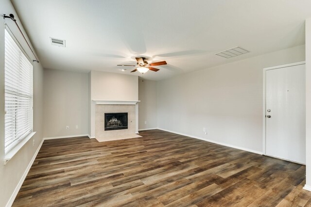 1508 Caymus Ct, Lewisville, TX 75067 - unfurnished living room featuring ceiling fan, plenty of natural light, and dark wood-type flooring