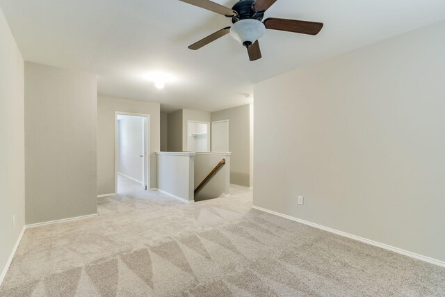 1508 Caymus Ct, Lewisville, TX 75067 - spare room featuring light carpet, baseboards, and a ceiling fan