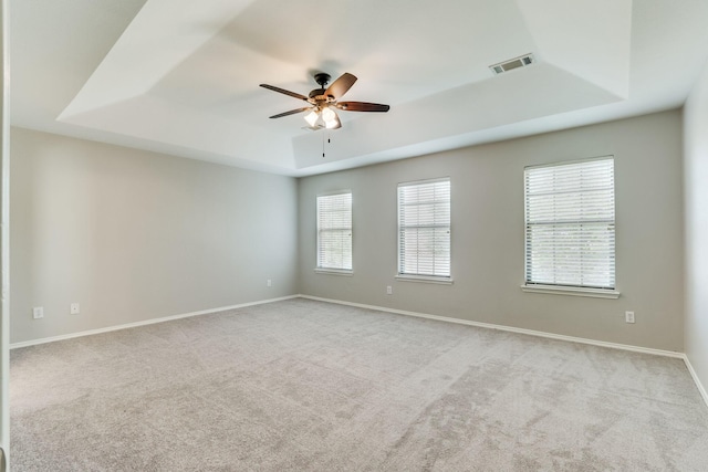 1508 Caymus Ct, Lewisville, TX 75067 - unfurnished room with a raised ceiling, carpet, ceiling fan, and baseboards