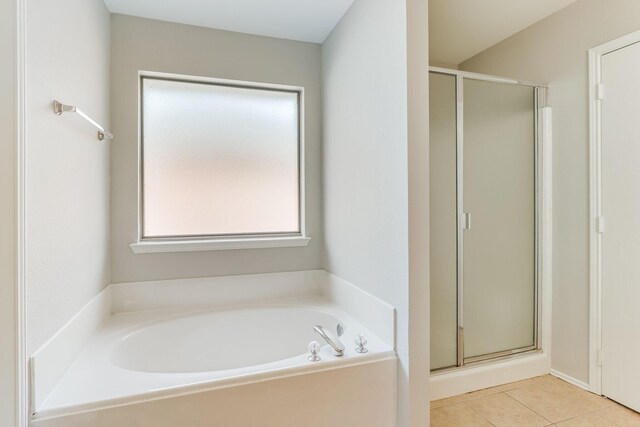 1508 Caymus Ct, Lewisville, TX 75067 - bathroom featuring a shower stall, a bath, and tile patterned flooring