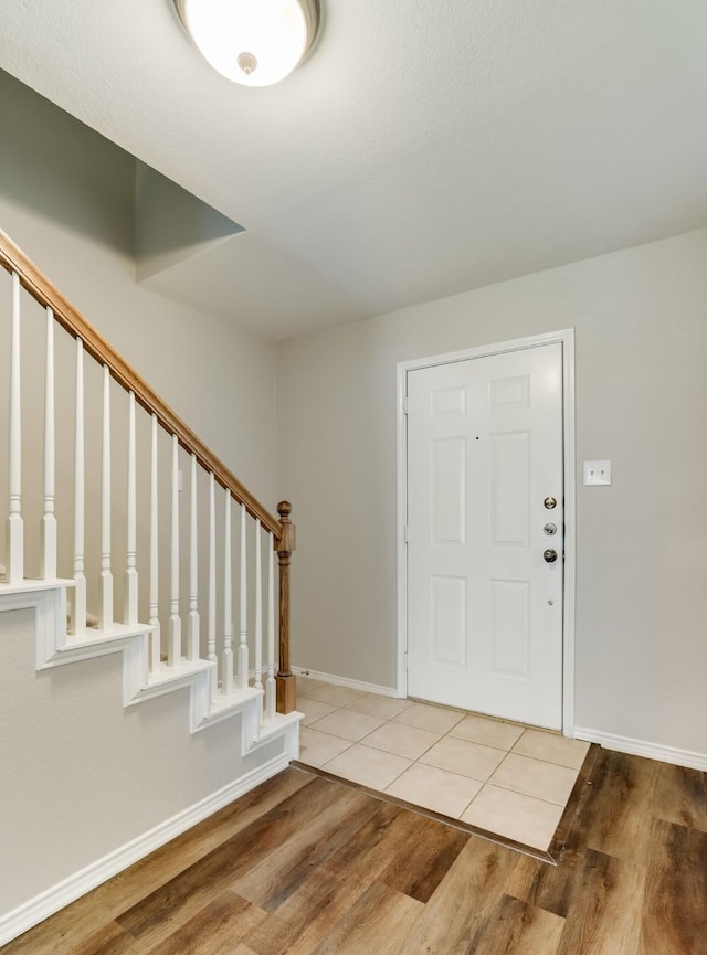 1508 Caymus Ct, Lewisville, TX 75067 - entrance foyer with wood finished floors, stairway, and baseboards