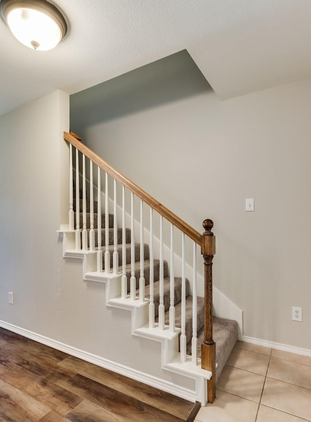 1508 Caymus Ct, Lewisville, TX 75067 - staircase featuring baseboards and wood finished floors