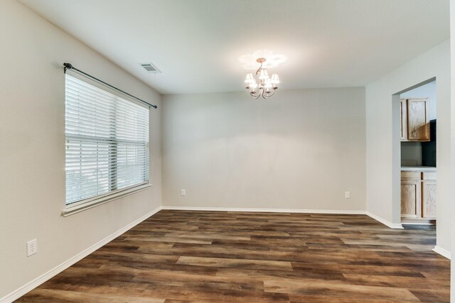 1508 Caymus Ct, Lewisville, TX 75067 - unfurnished room featuring a chandelier, dark wood-type flooring, and baseboards