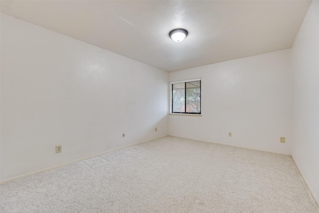 2807 Lineville Dr Unit 104, Farmers Branch, TX 75234 - spare room with carpet floors and baseboards