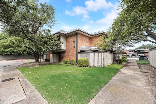 2807 Lineville Dr Unit 104, Farmers Branch, TX 75234 - view of front facade featuring brick siding