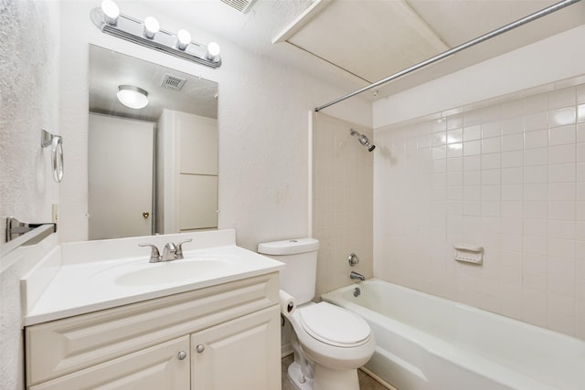 2807 Lineville Dr Unit 104, Farmers Branch, TX 75234 - bathroom with a textured wall, toilet, tub / shower combination, and vanity