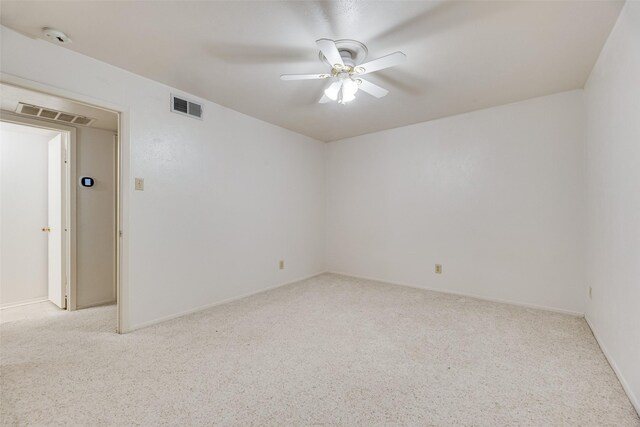 2807 Lineville Dr Unit 104, Farmers Branch, TX 75234 - spare room featuring carpet, a ceiling fan, a smoke detector, and baseboards