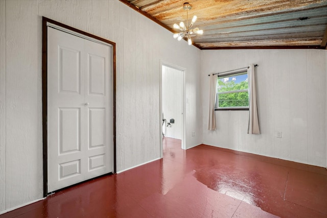 1083 Vz County Road 1319, Grand Saline, TX 75140 - spare room featuring wood ceiling, a chandelier, and wooden walls