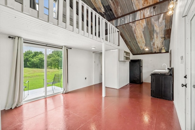 1083 Vz County Road 1319, Grand Saline, TX 75140 - unfurnished living room with a sink, vaulted ceiling, and finished concrete flooring