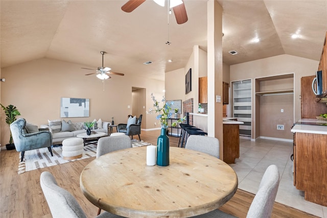 10328 Lone Pine Ln, Fort Worth, TX 76108 - dining area with ceiling fan, vaulted ceiling, baseboards, light wood finished floors, and built in features