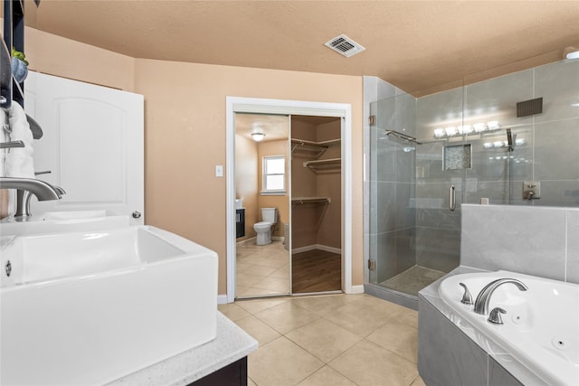 10328 Lone Pine Ln, Fort Worth, TX 76108 - full bath featuring a stall shower, tile patterned flooring, a tub with jets, vanity, and baseboards