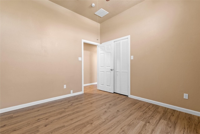 10328 Lone Pine Ln, Fort Worth, TX 76108 - spare room featuring light wood finished floors, baseboards, and a high ceiling