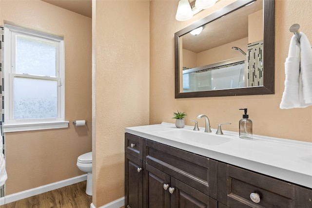 10328 Lone Pine Ln, Fort Worth, TX 76108 - bathroom with baseboards, wood finished floors, toilet, a shower with door, and vanity