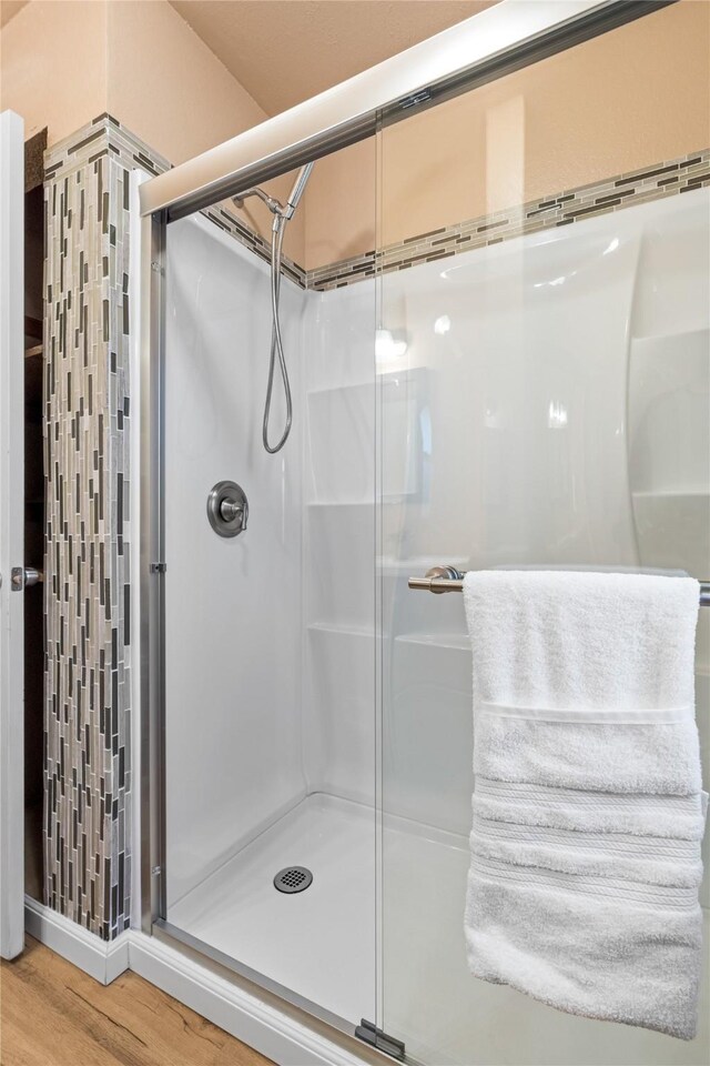 10328 Lone Pine Ln, Fort Worth, TX 76108 - bathroom with a stall shower and wood finished floors