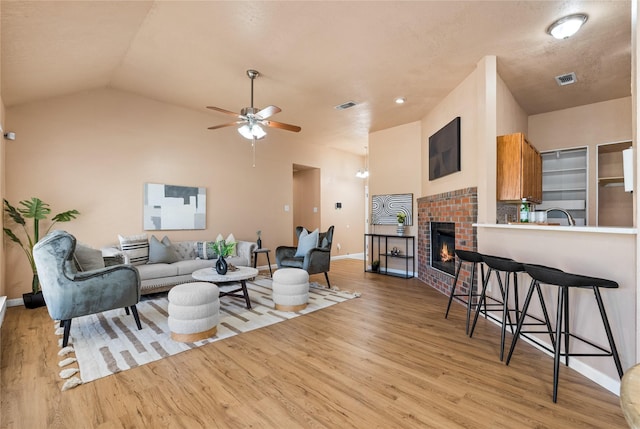 10328 Lone Pine Ln, Fort Worth, TX 76108 - living area featuring wood finished floors, baseboards, a fireplace, and lofted ceiling