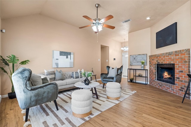 10328 Lone Pine Ln, Fort Worth, TX 76108 - living area with wood finished floors, ceiling fan, a fireplace, baseboards, and a chandelier