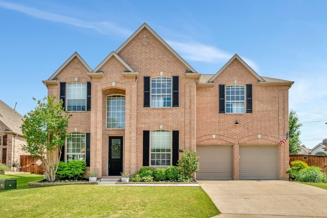 940 Crown Ct, Highland Village, TX 75077 - view of front of house with concrete driveway, brick siding, and a garage