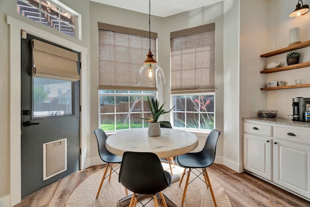 940 Crown Ct, Highland Village, TX 75077 - dining space with light wood-style flooring and baseboards