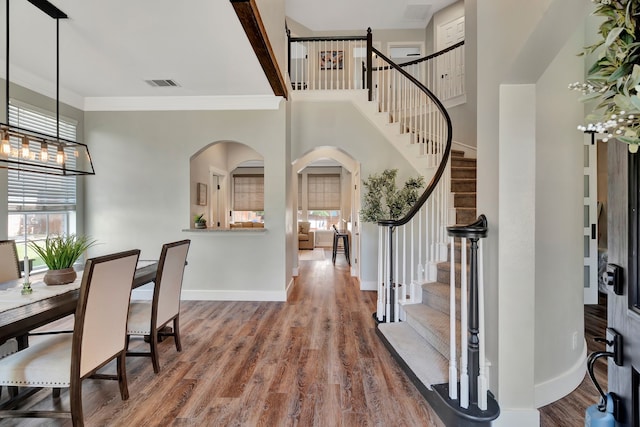 940 Crown Ct, Highland Village, TX 75077 - entryway featuring stairway, wood finished floors, baseboards, and crown molding