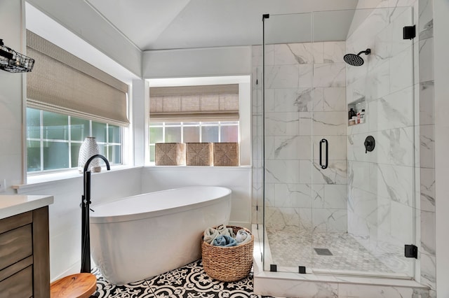 940 Crown Ct, Highland Village, TX 75077 - bathroom with a freestanding bath, a stall shower, vanity, and vaulted ceiling