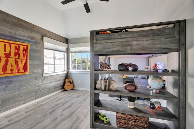 940 Crown Ct, Highland Village, TX 75077 - detailed view of wooden walls, ceiling fan, wood finished floors, and baseboards