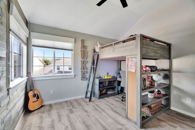 940 Crown Ct, Highland Village, TX 75077 - bedroom with vaulted ceiling, wood finished floors, baseboards, and ceiling fan