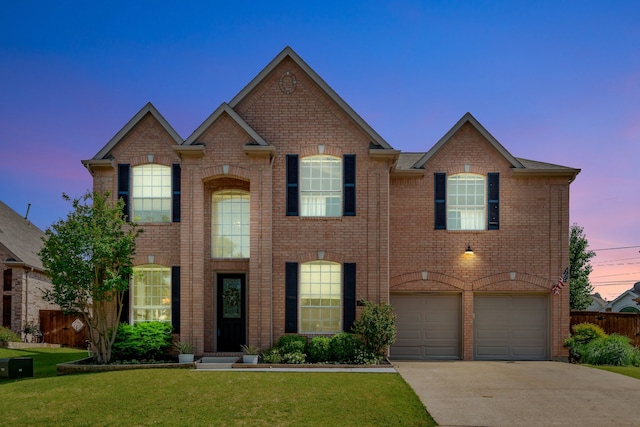 940 Crown Ct, Highland Village, TX 75077 - view of front of house featuring concrete driveway, brick siding, and a garage