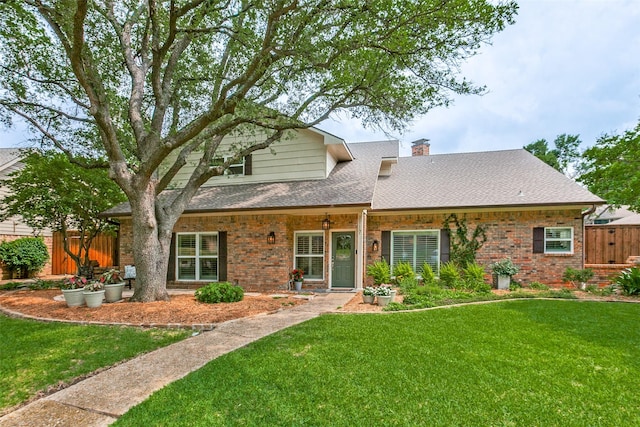 1117 Brandy Sta, Richardson, TX 75080 - rear view of house featuring roof with shingles, a chimney, and brick siding