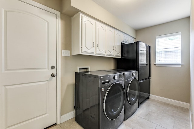 1117 Brandy Sta, Richardson, TX 75080 - laundry room with baseboards, washing machine and clothes dryer, cabinet space, and light tile patterned flooring